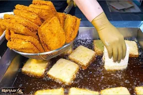 غذای خیابانی ؛ ببینید کره ای ها چجوری سالاد الویه رو تو روغن داغ سوخاری می کنند
